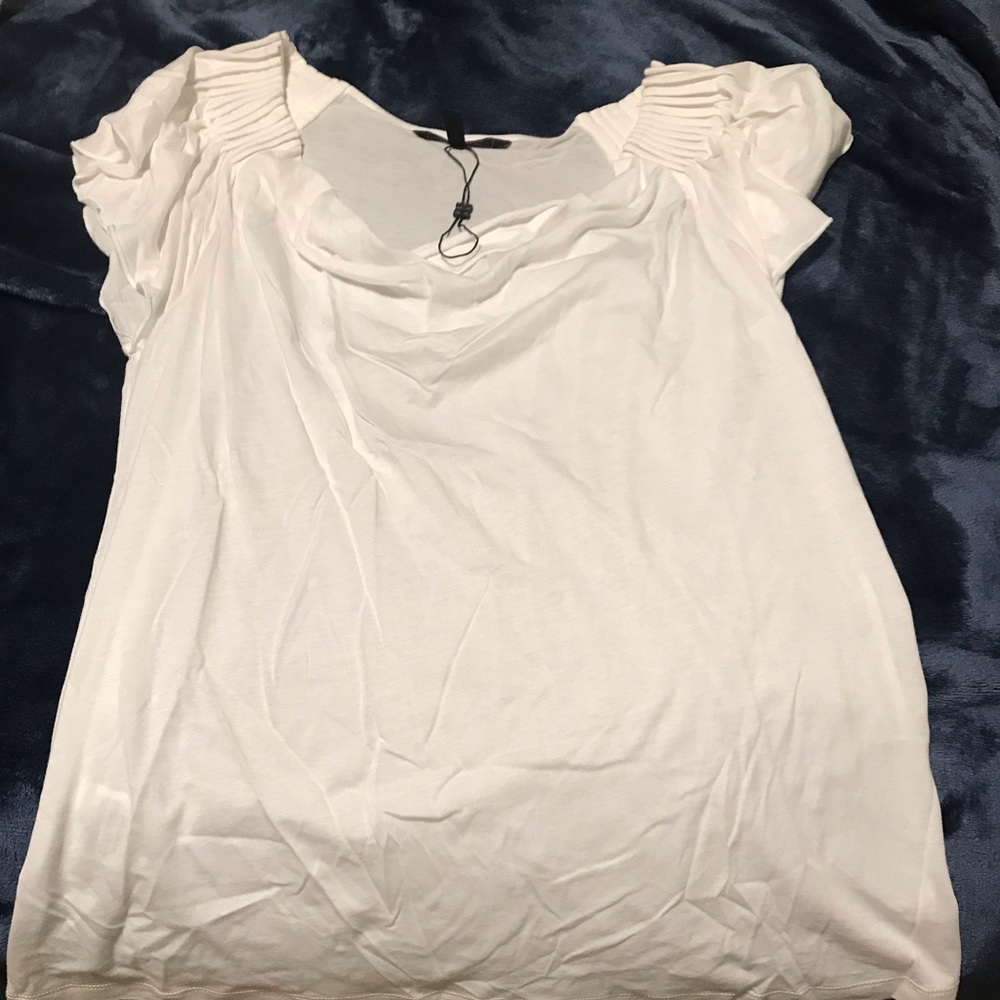 Women’s white t with ruffle shoulder line